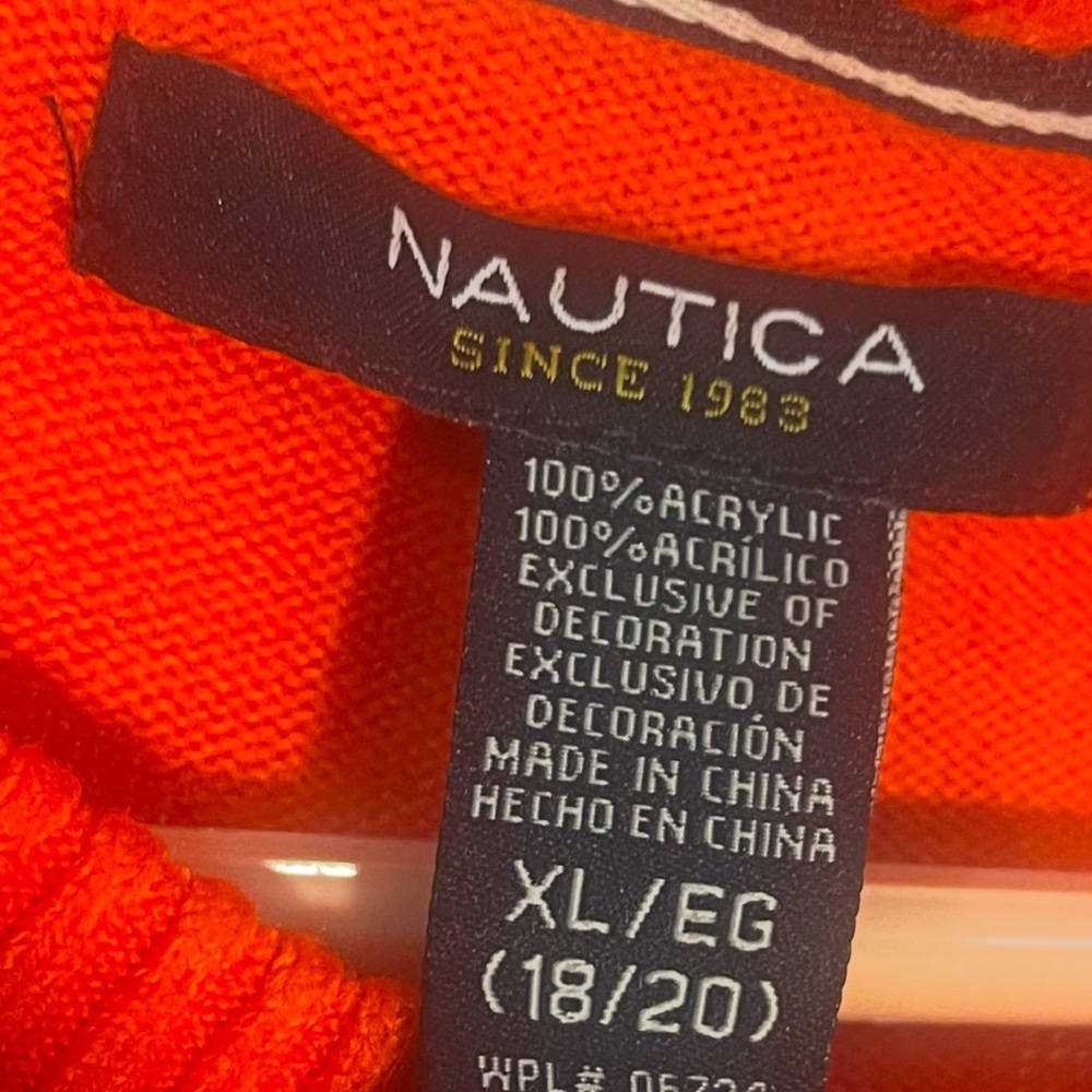 Orange with Blue Nautical.  This is a Like new sweater, XL 18-20.